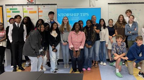 Associate Professor Janise Parker (center) poses with high school student mentors in the Youth Volunteer Corps of Hampton Roads (YVCHR).