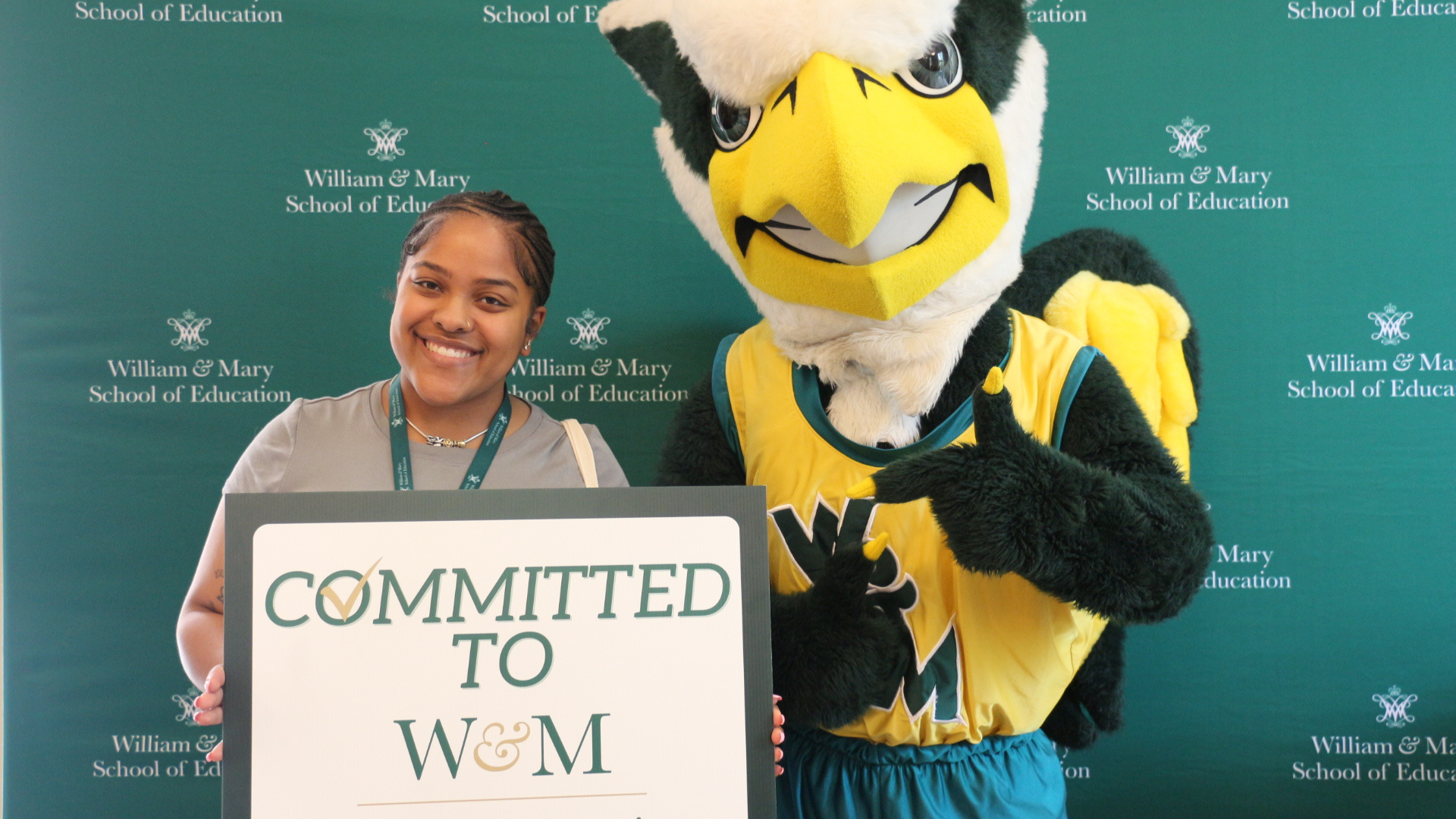 Admitted Students Day 2026 two students post with the Griffin mascot