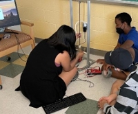 Students make adjustments to their Physics project