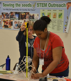 Students build towers that will be put the test to see how much weight it can bear at the First Annual Hampton Roads STEM Summer Academy. Photo Credit: Karen Hogue