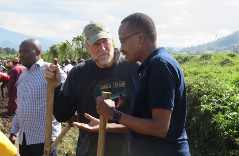 Spencer Niles talks with the Minister of Defense for Rwanda as part of the study-abroad program he led there this summer.