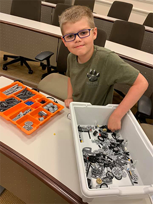 A student in one of the Center for Gifted Education's enrichment programs prepares for a robotics challenge.