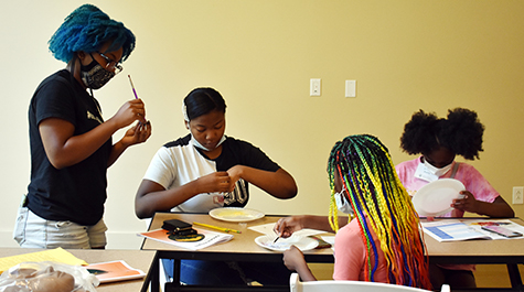 In one design challenge, campers developed and branded their own line of natural cosmetics. 