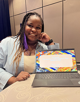 Shené Owens Ph.D. '23 practices defending her research proposal during the roundtable session.