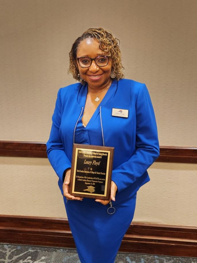 Loury Floyd, Ph.D. '03  receives her award from the North Carolina Association of Colleges for Teacher Education
