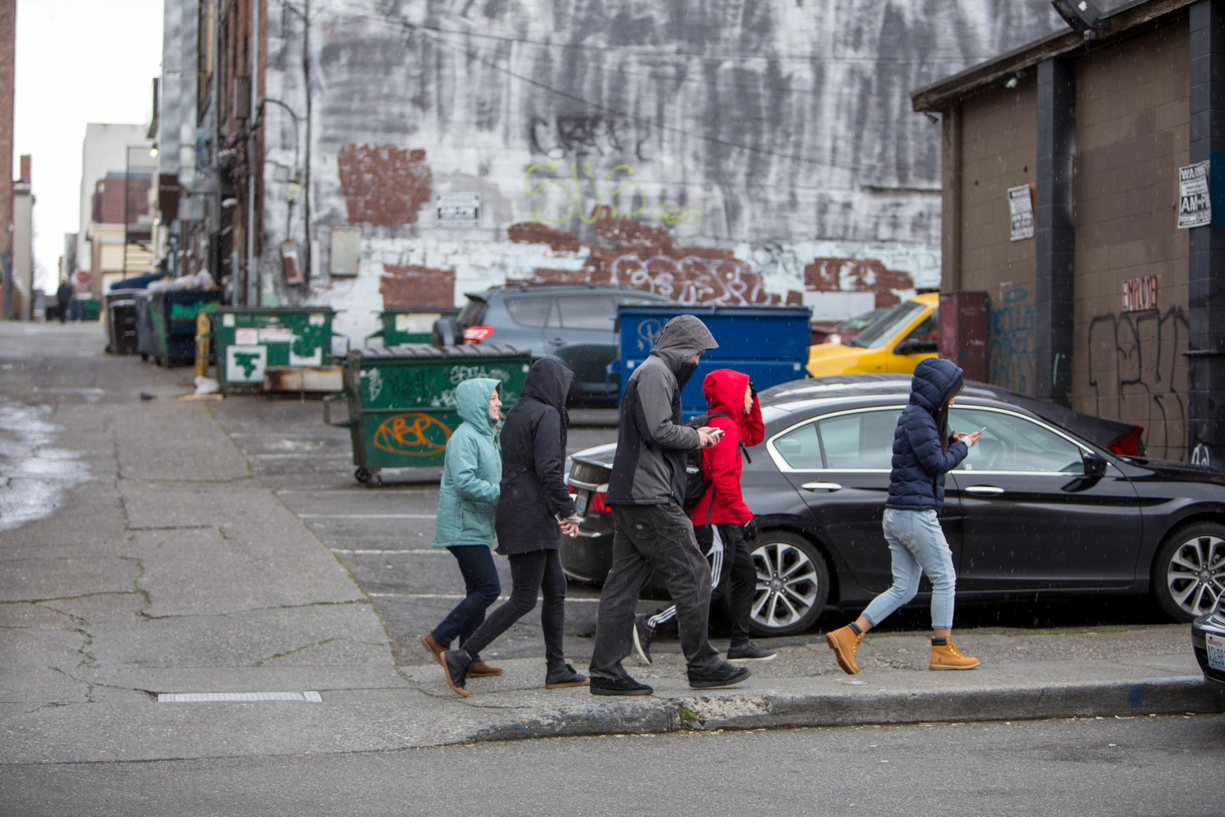 Young people learning about their city on a group walk. Photo Credit: UW Katie Headrick Taylor.