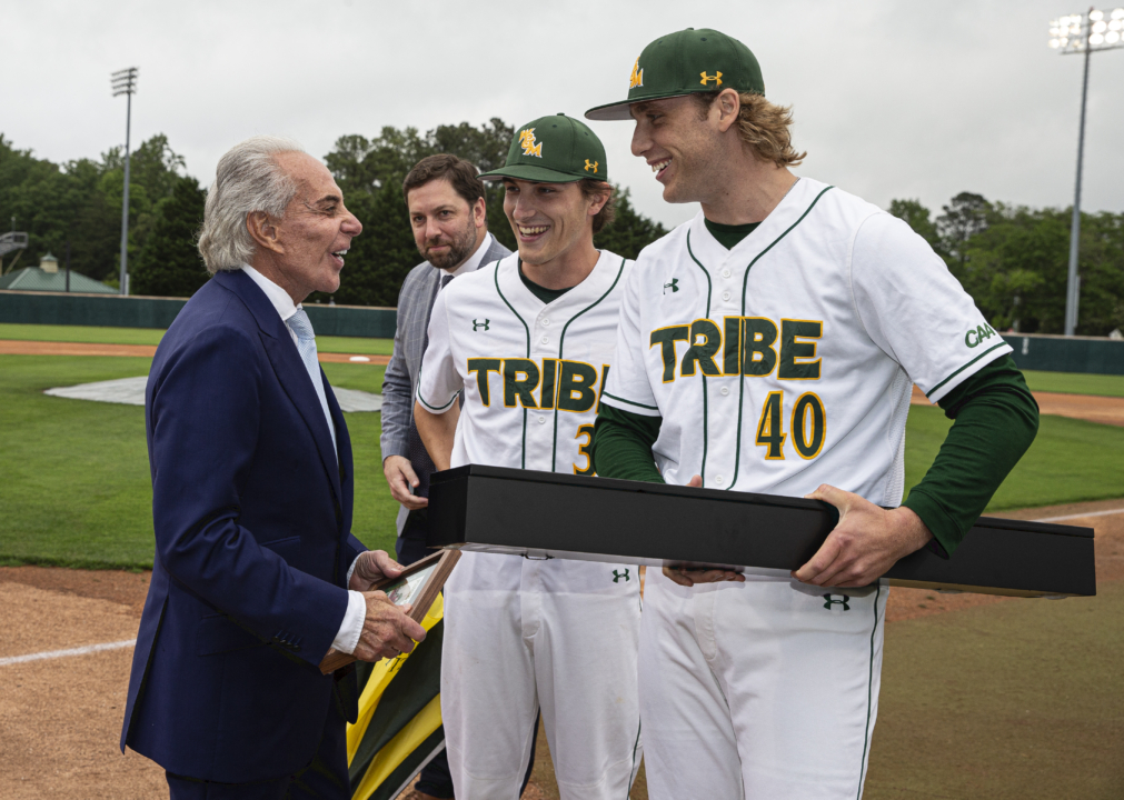 Members of the W&M baseball team and Director of Athletics Brian Mann present Plumeri with a commemorative baseball bat in honor of the 25th anniversary of Plumeri Park. (Photo by Robert Keroack ’79)