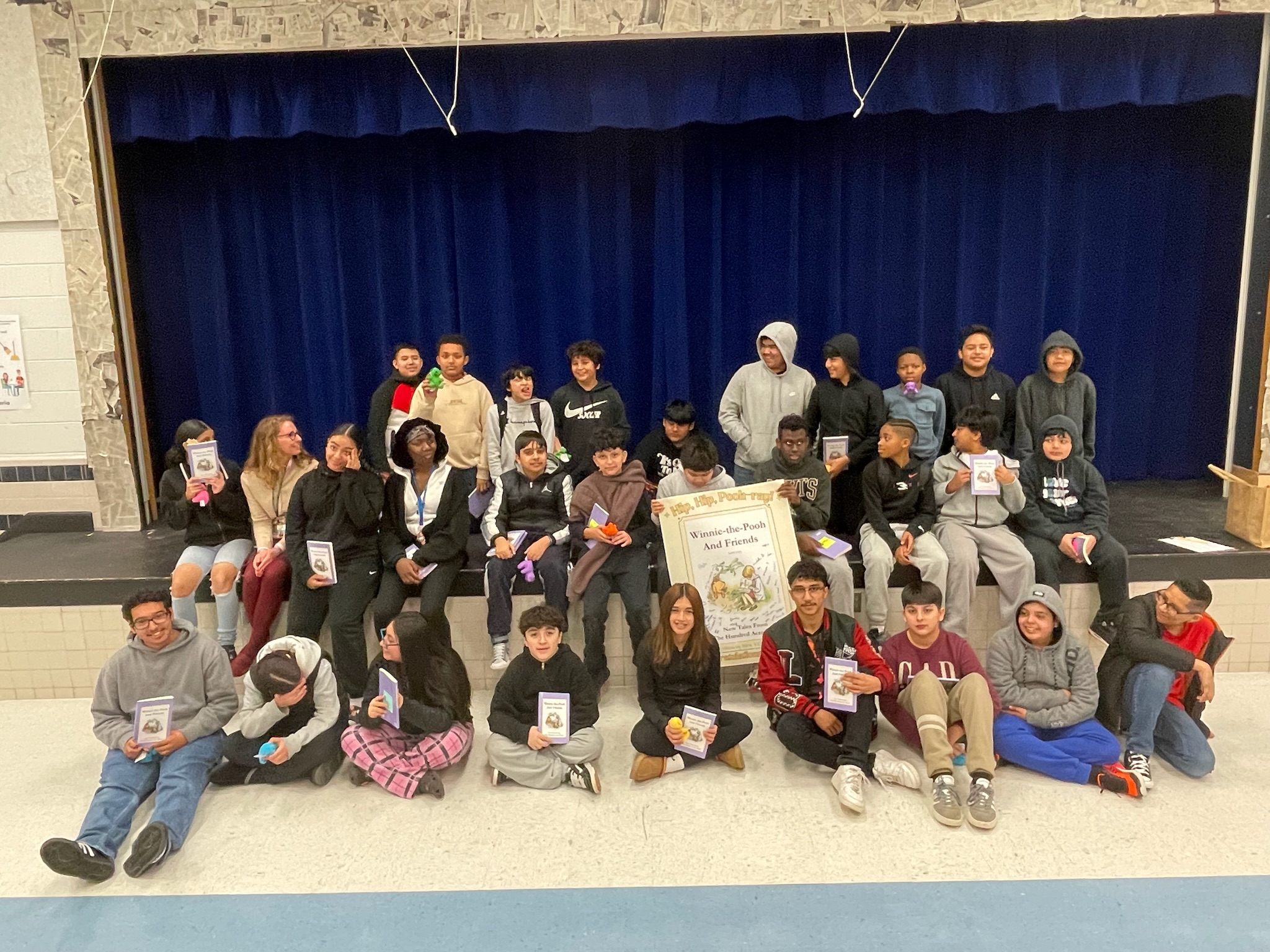 Students celebrated their achievement with a signed poster and copies of their book at the launch party.